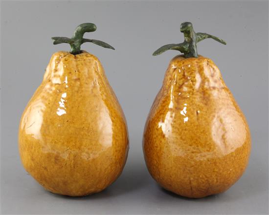 A pair of Chinese Canton pottery large models of persimmon fruit, late 19th century, height 23cm
